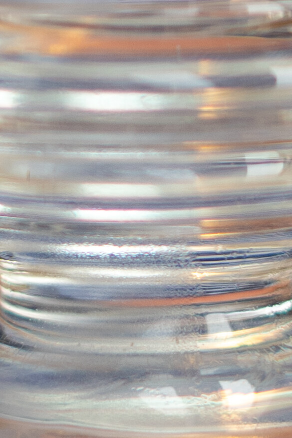 Close-up of ribbed glass catching the light